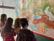 Foto of pupils standing in front of a map of Europe